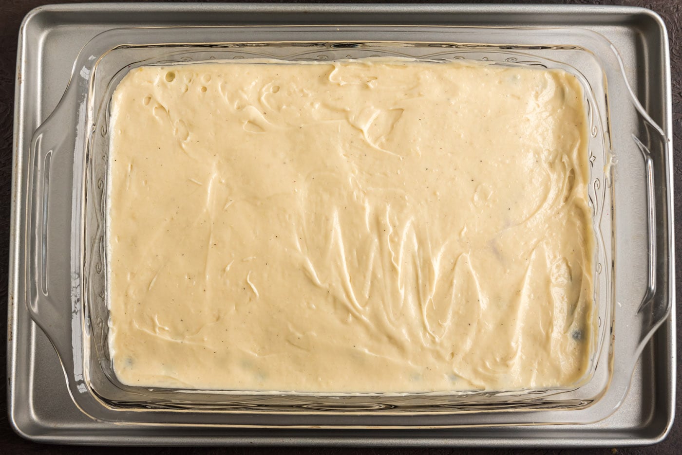 blueberry upside down cake batter in a dish