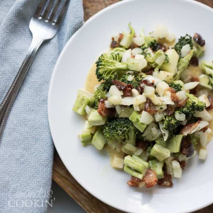 This broccoli salad is a fresh mixture of broccoli, bacon, cheese, and onion. Bring this staple dish to your next potluck or family gathering!