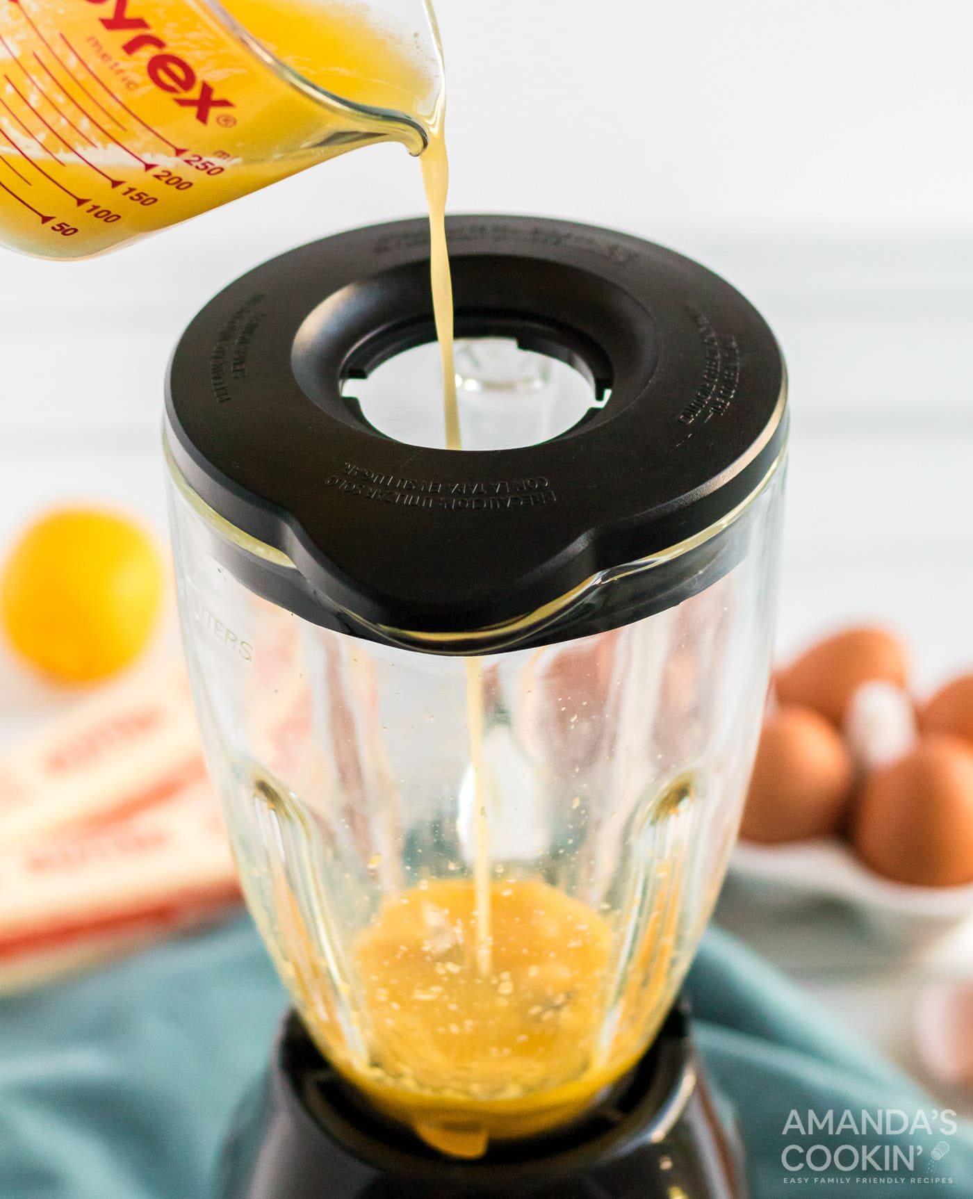adding butter to blender