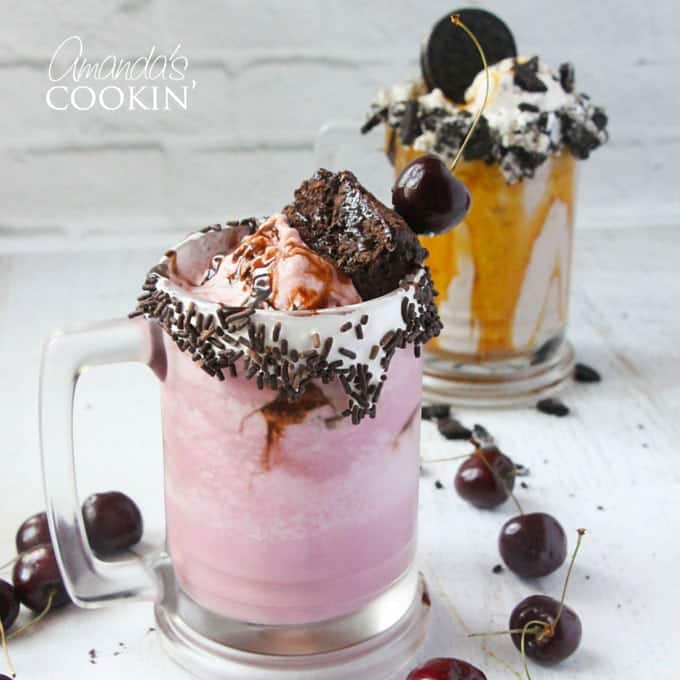 A photo of a cherry fudge chunk freakshake and a double caramel cookie crunch freakshake in the background.
