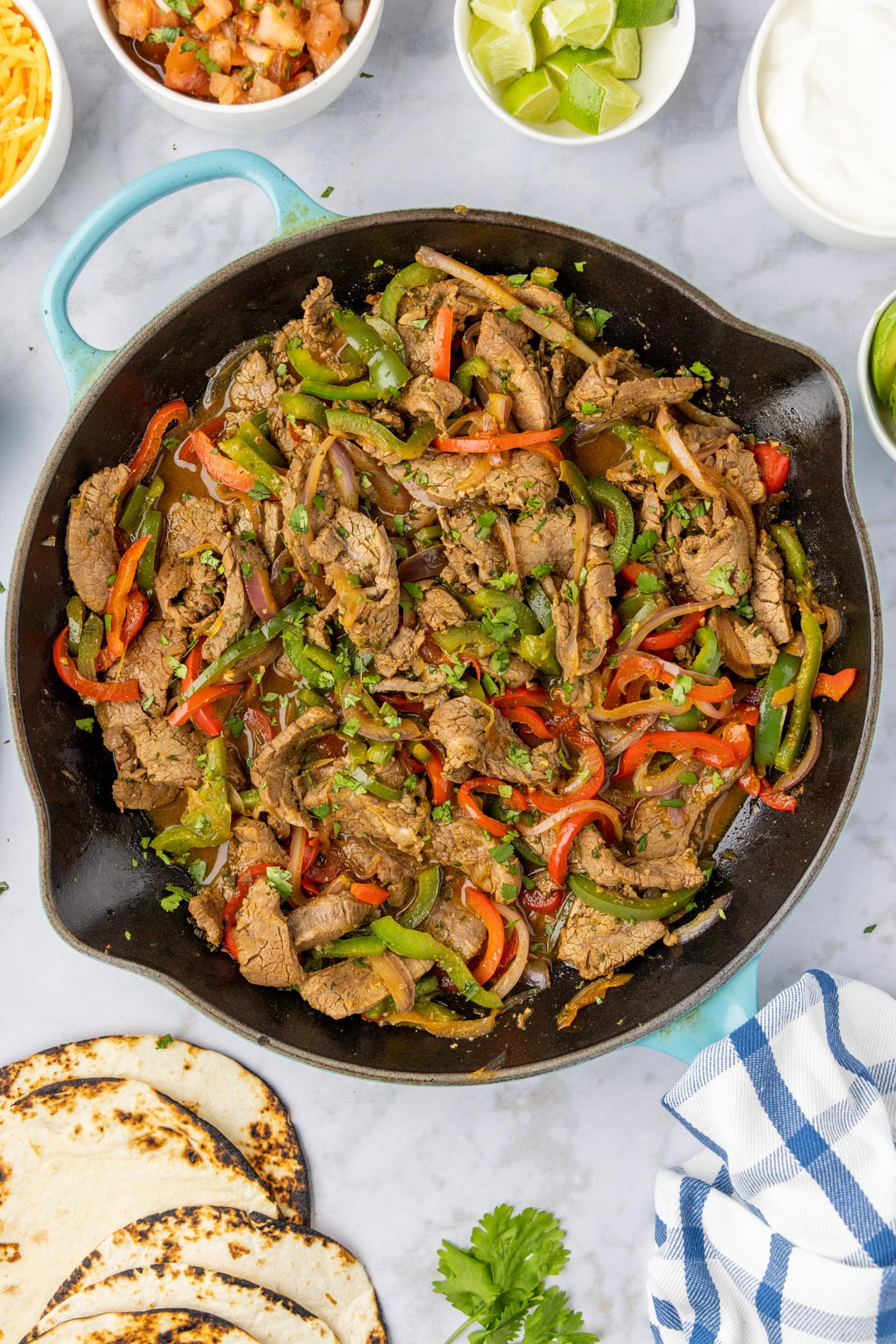 Steak fajitas in a cast iron skillet