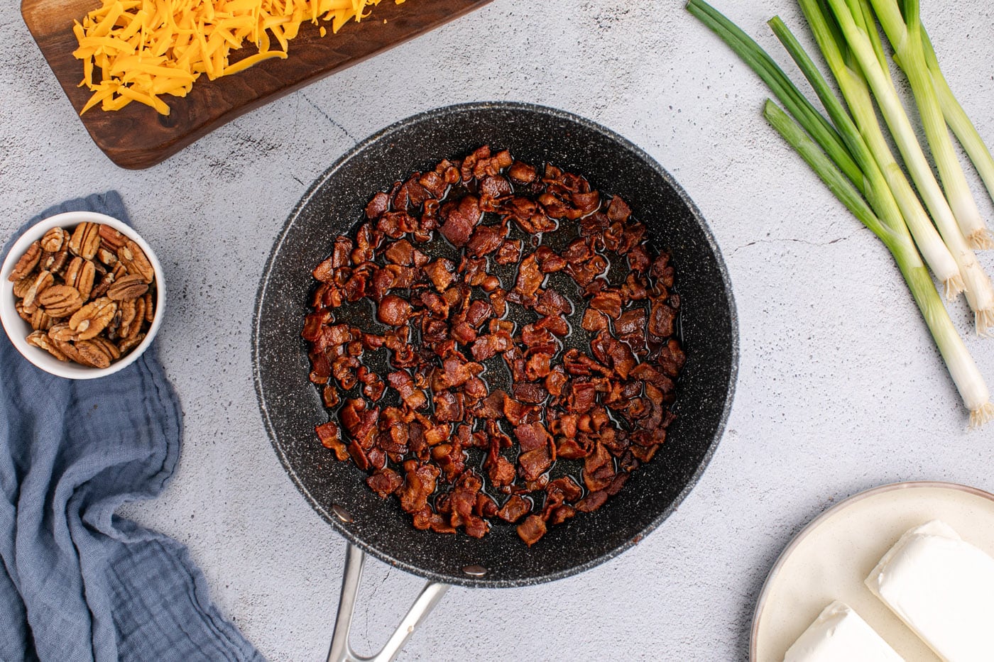cooked bacon bits in a skillet