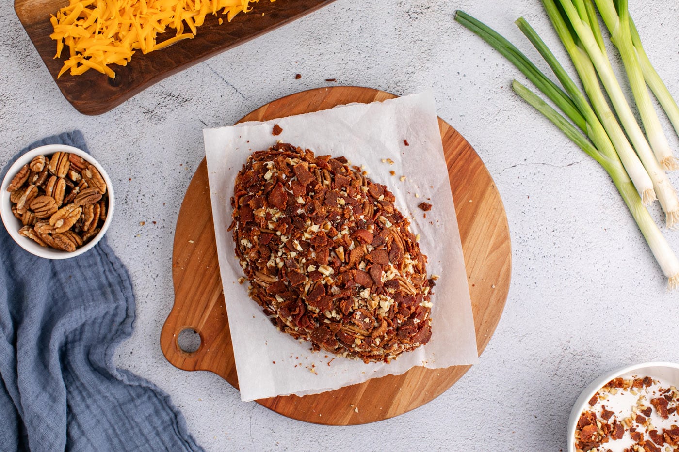 chopped bacon and pecans on top of cheese ball