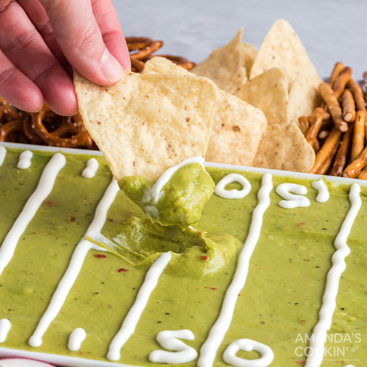 dipping a chip into guacamole