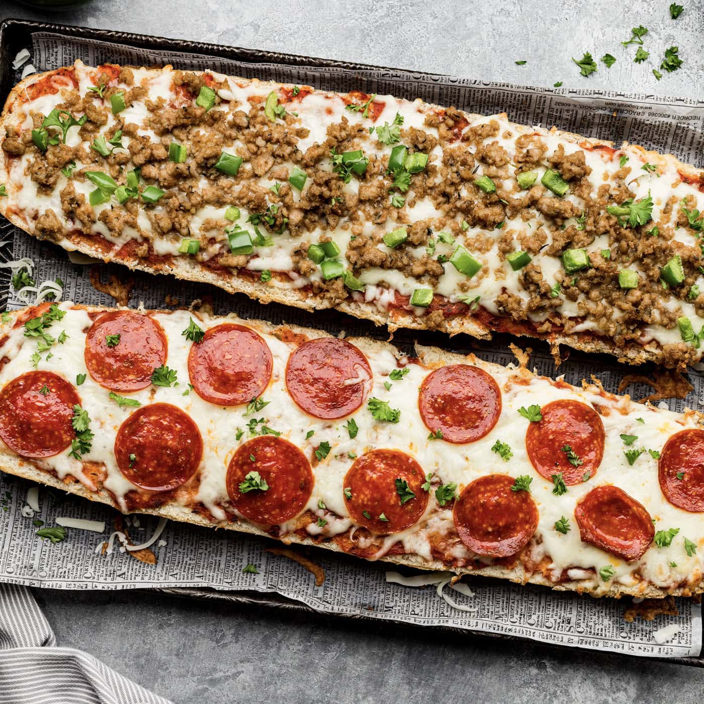 overhead photo of french bread pizza on a baking sheet