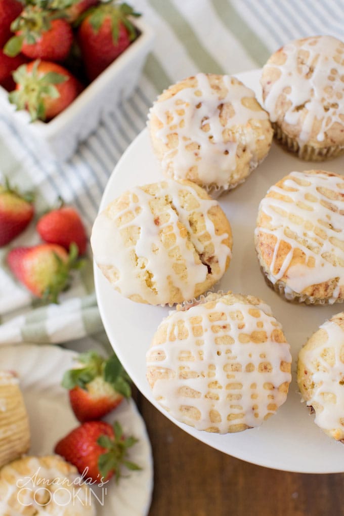 plate full of glazed strawberry muffins
