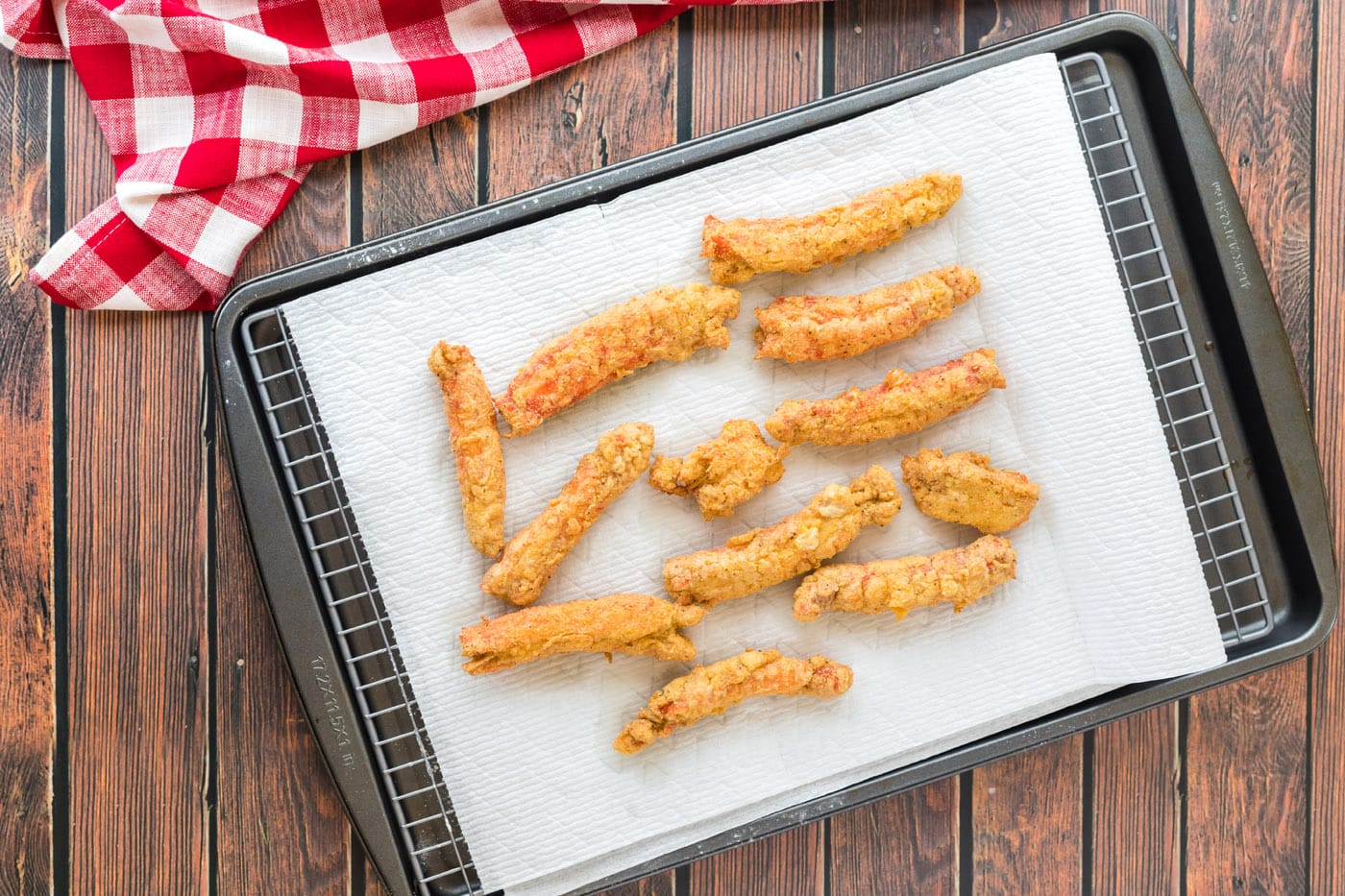 fried crab legs on a paper towel