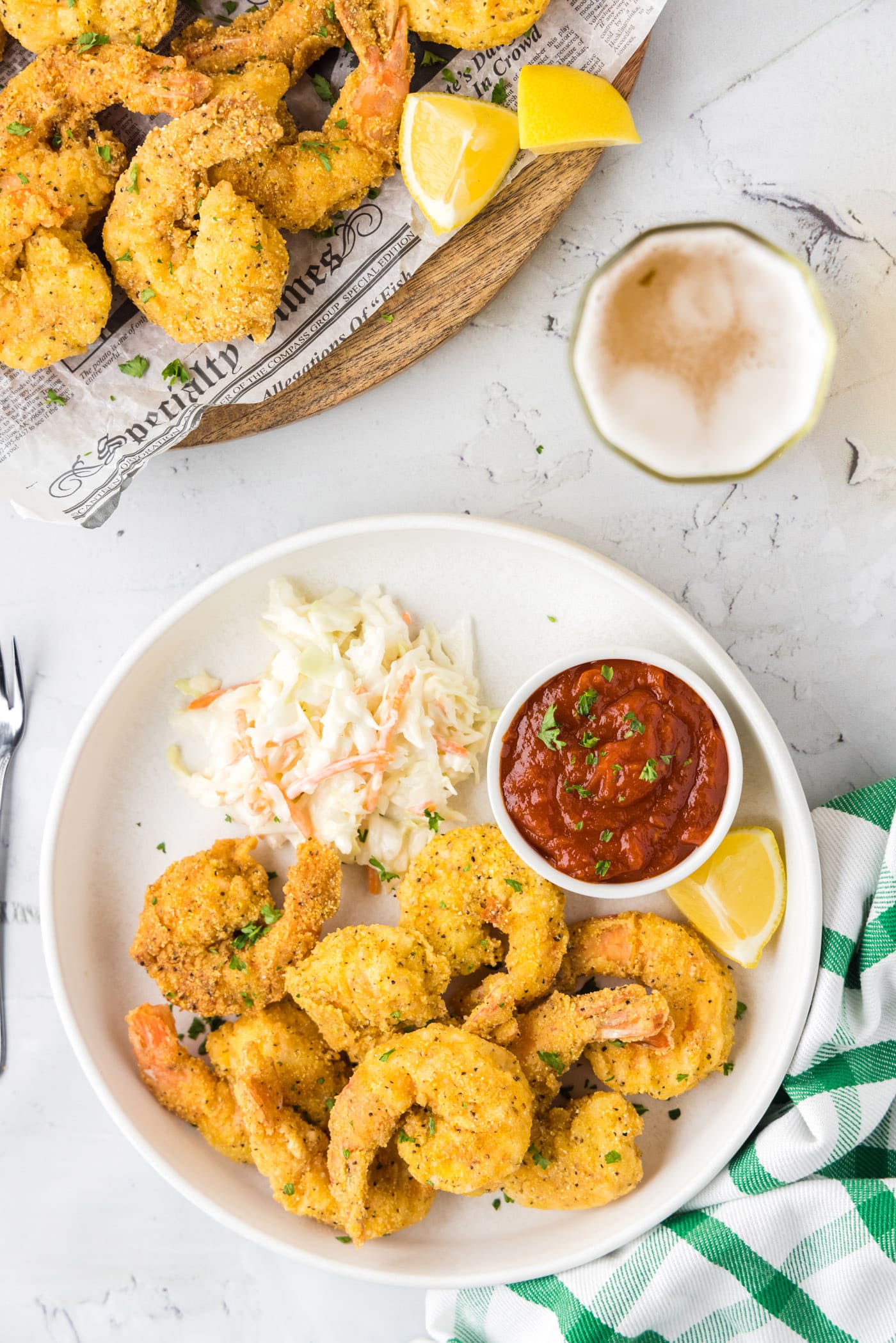 Plate of Fried Shrimp with a bowl of cocktail sauce and coleslaw