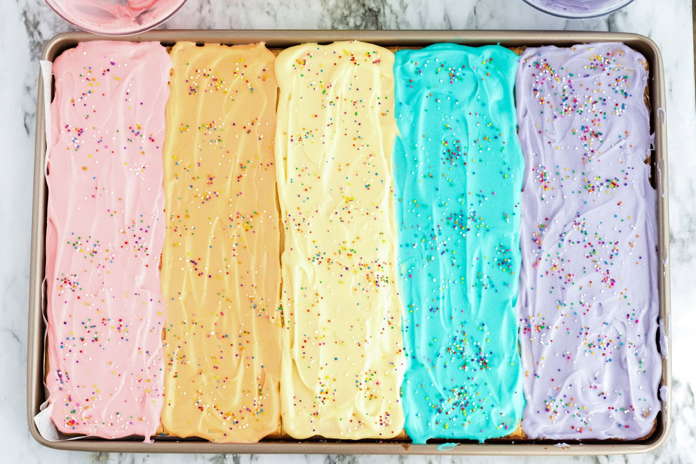 Frosted Sugar Cookie Bars topped with sprinkles