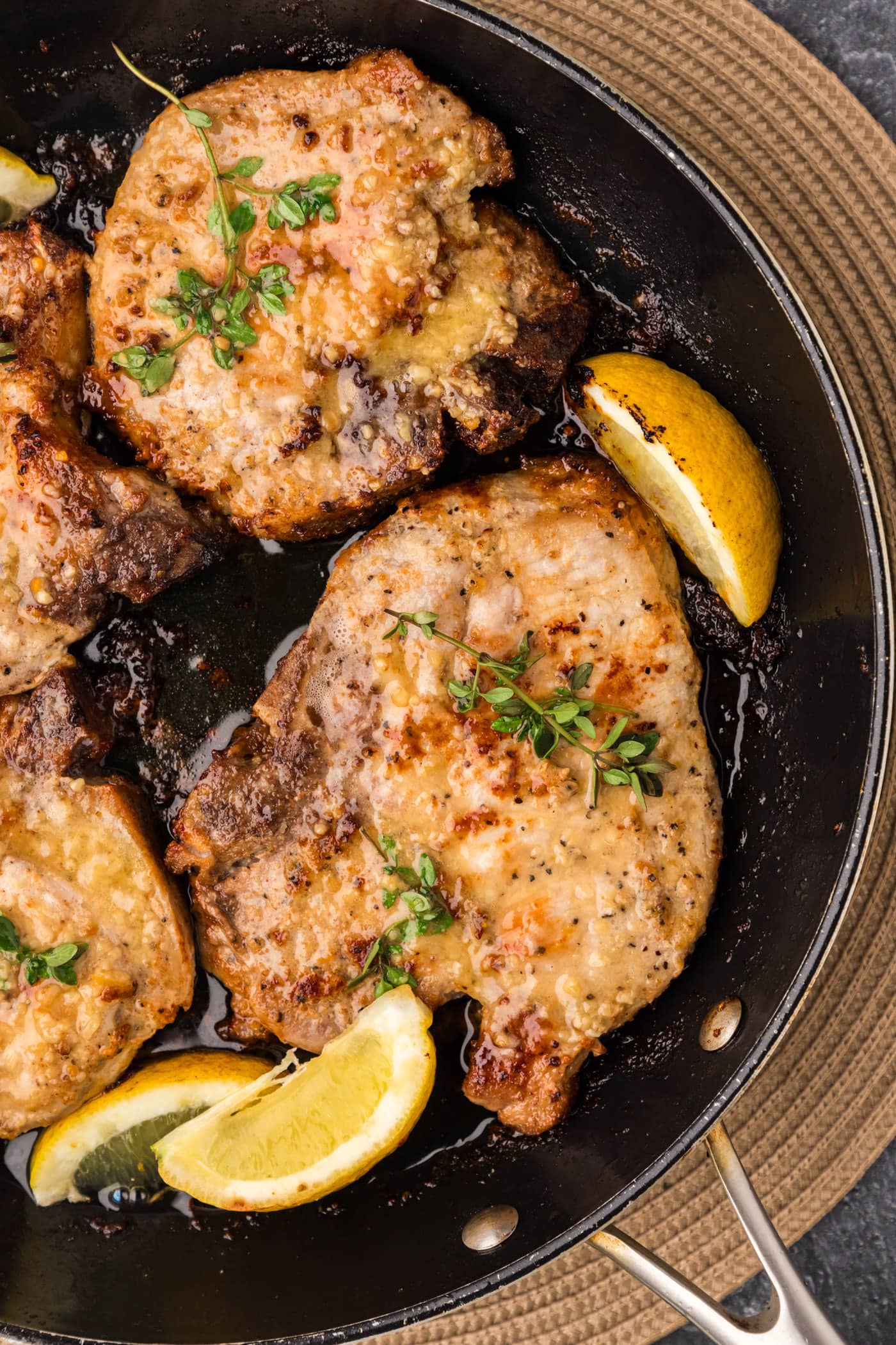 Close up photo of Garlic Butter Pork Chops in a skillet