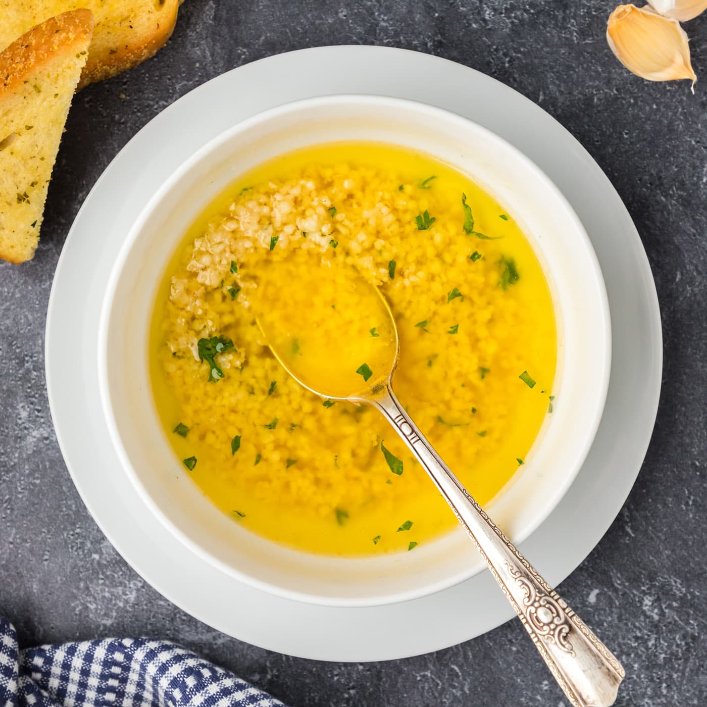 Bowl of Garlic Butter Sauce with a spoon in it