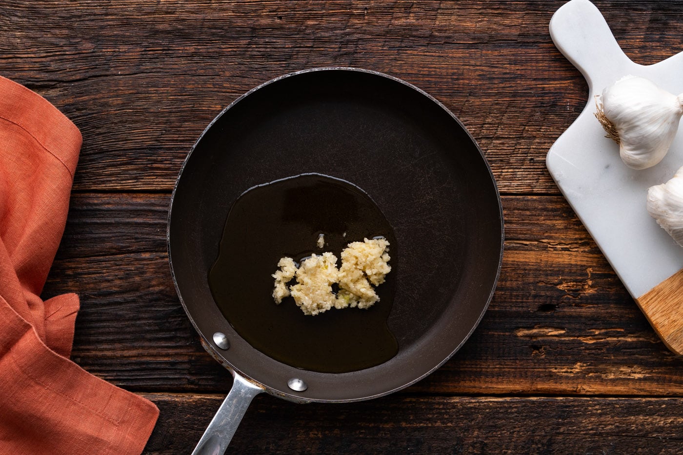 minced garlic in a skillet with oil