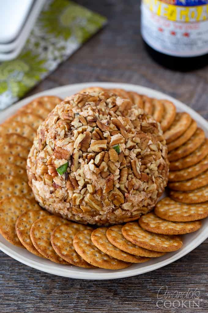 cheese ball on plate surrounded by crackers