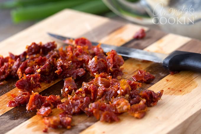 Shape mixture into 1 large or 2 small balls or logs; roll in pecans.