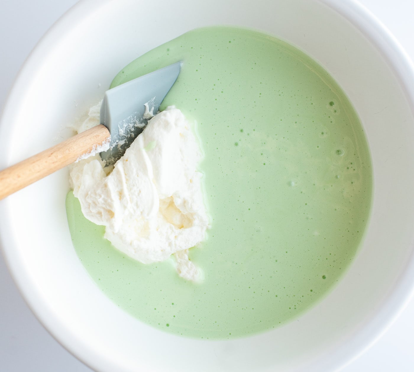 green food coloring and pepper mint extract mixed with marshmallow mixture