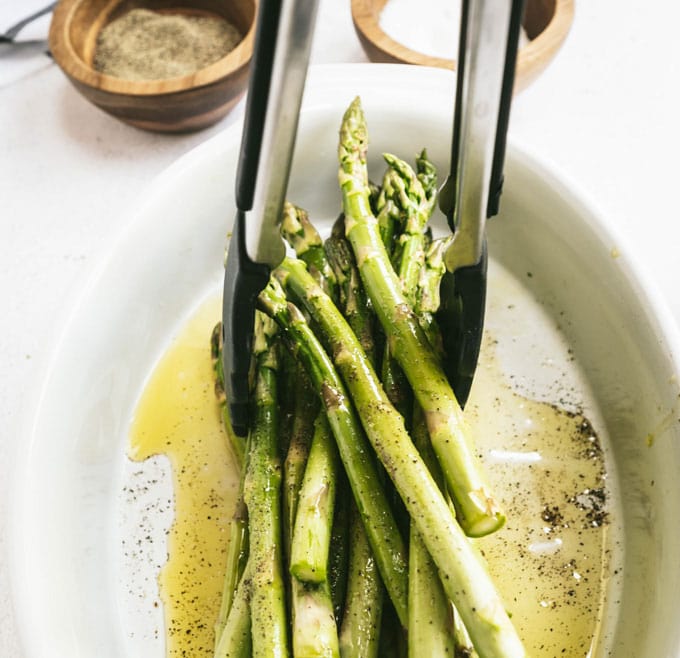 lifting asparagus with tongs