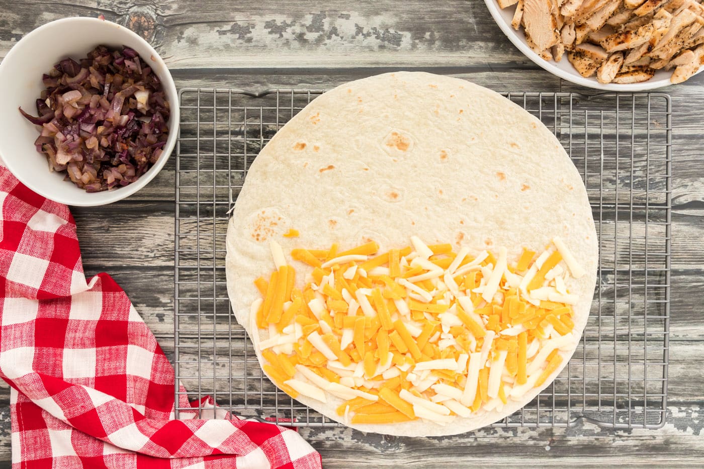 cheese on one side of tortilla shell