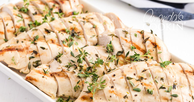 sliced grilled chicken breasts on a platter