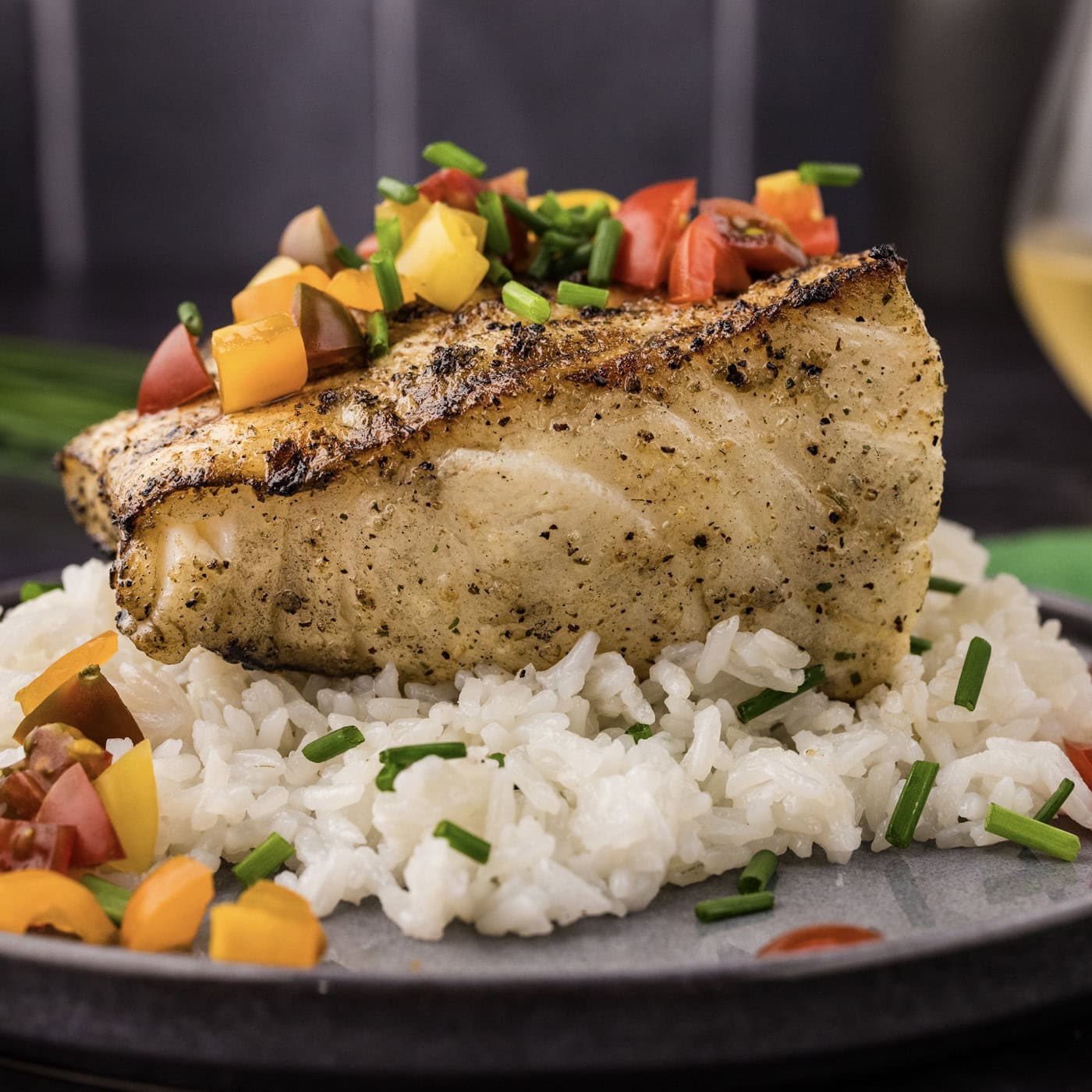 Close up photo of Grilled Chilean Sea Bass on a bed of rice