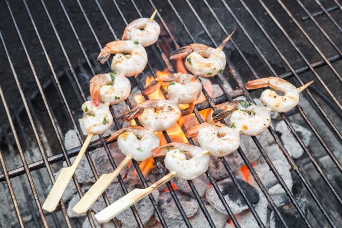 skewered shrimp on a charcoal grill
