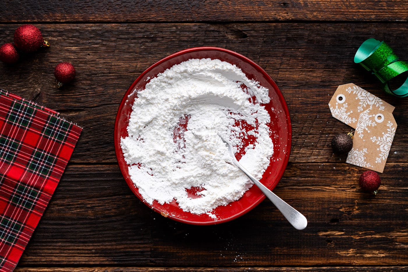 mixing together cornstarch and powdered sugar on a plate