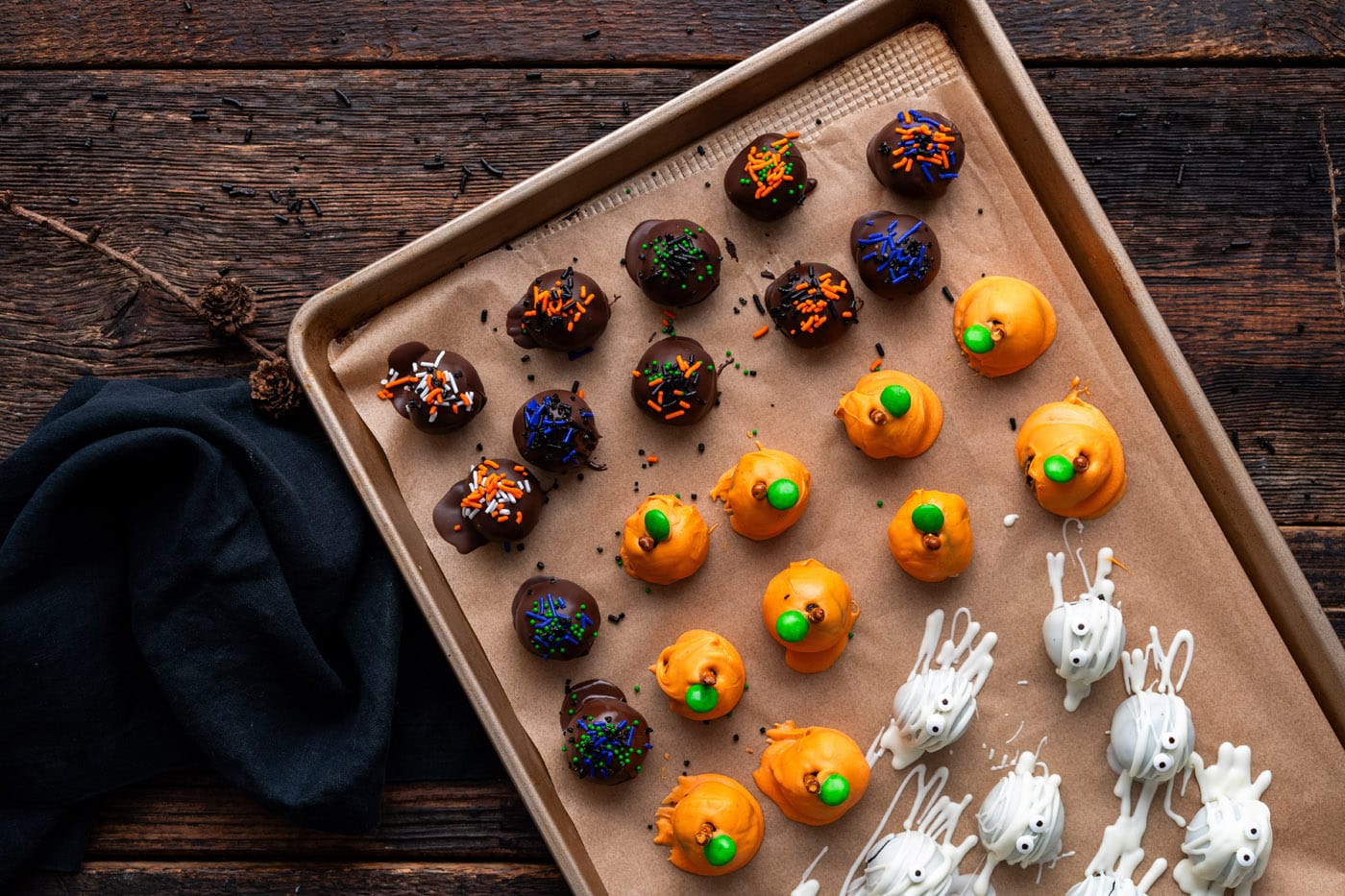 Halloween oreo truffles on a baking sheet