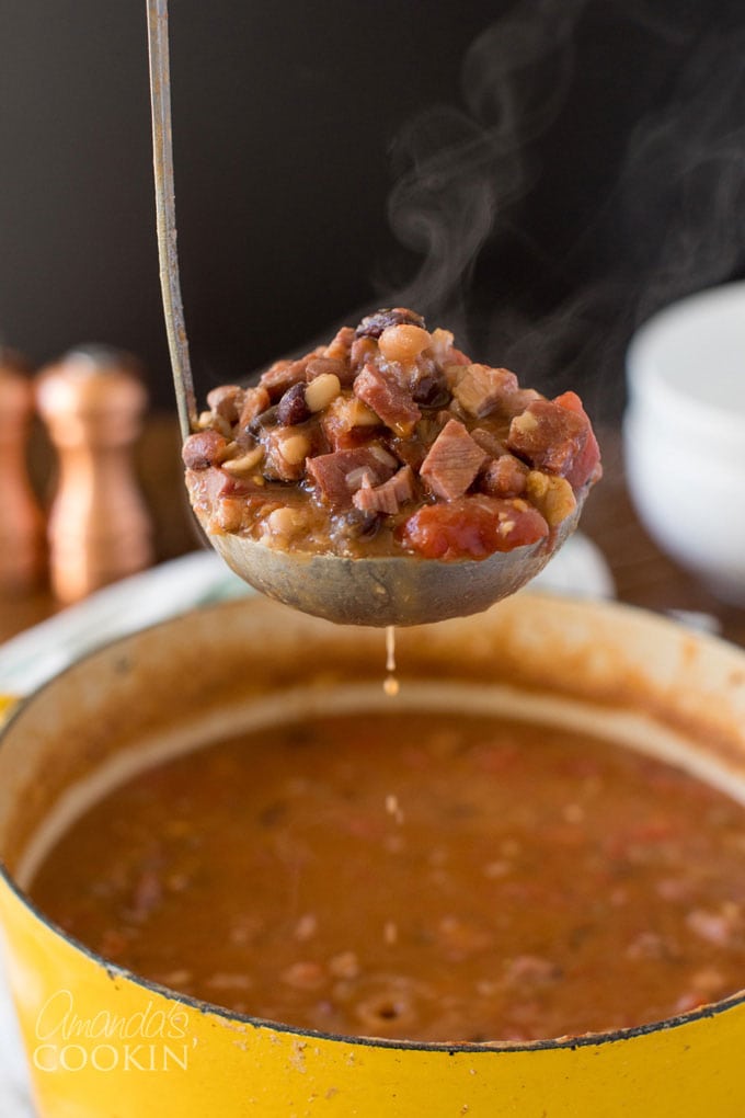 stemaing ladle of ham and bean soup
