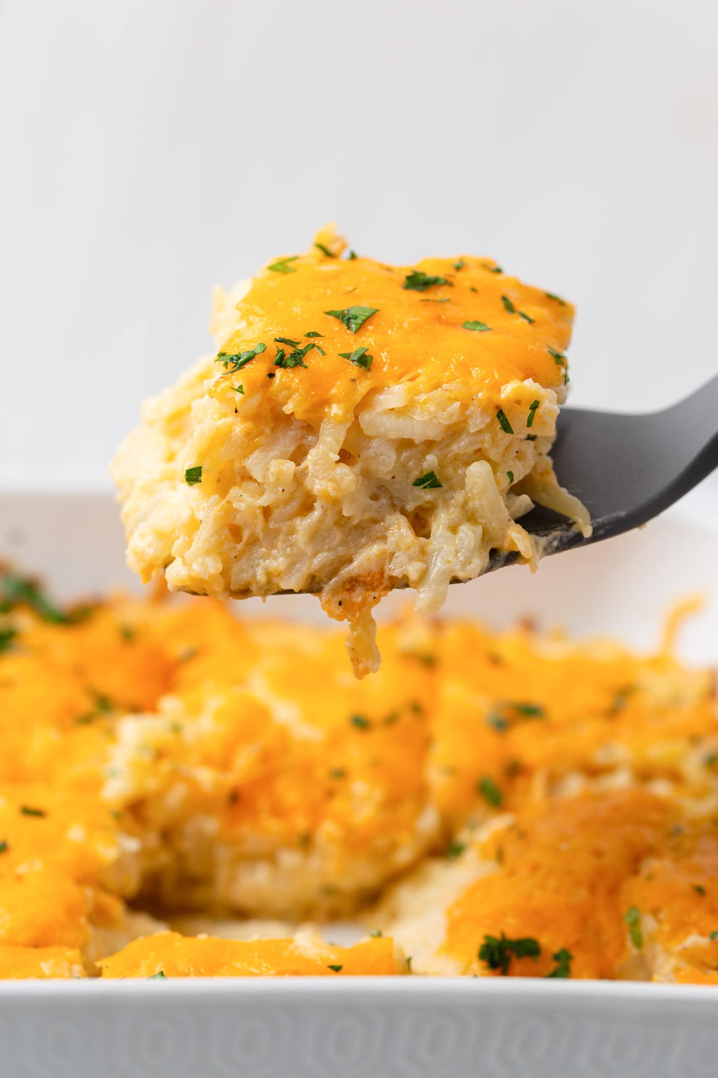 spatula lifting Hashbrown Casserole