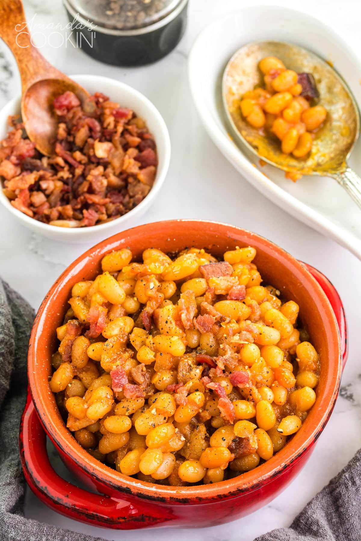 crock of homemade baked beans on a table