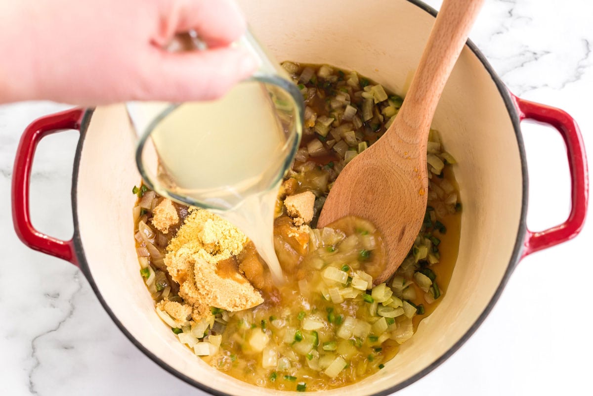 adding sugar and other ingredients to pan