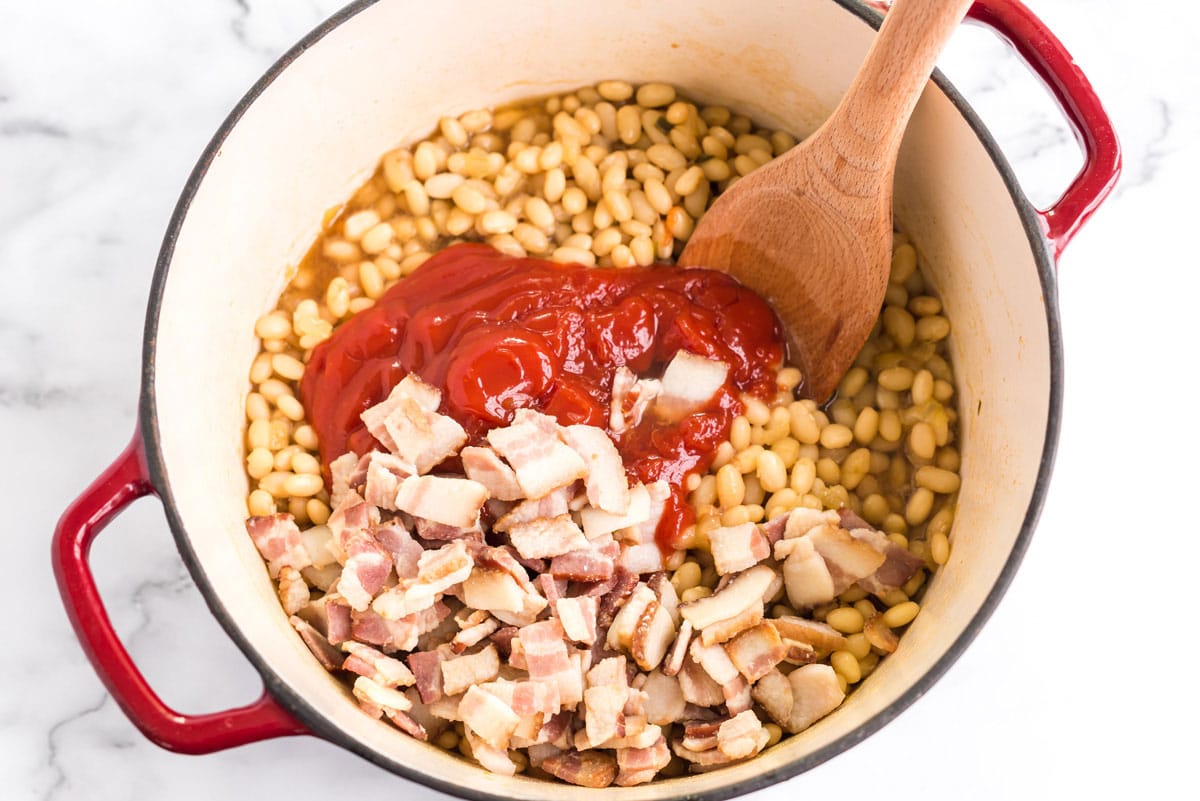 ketchup, bacon, and bean mixture in a pan