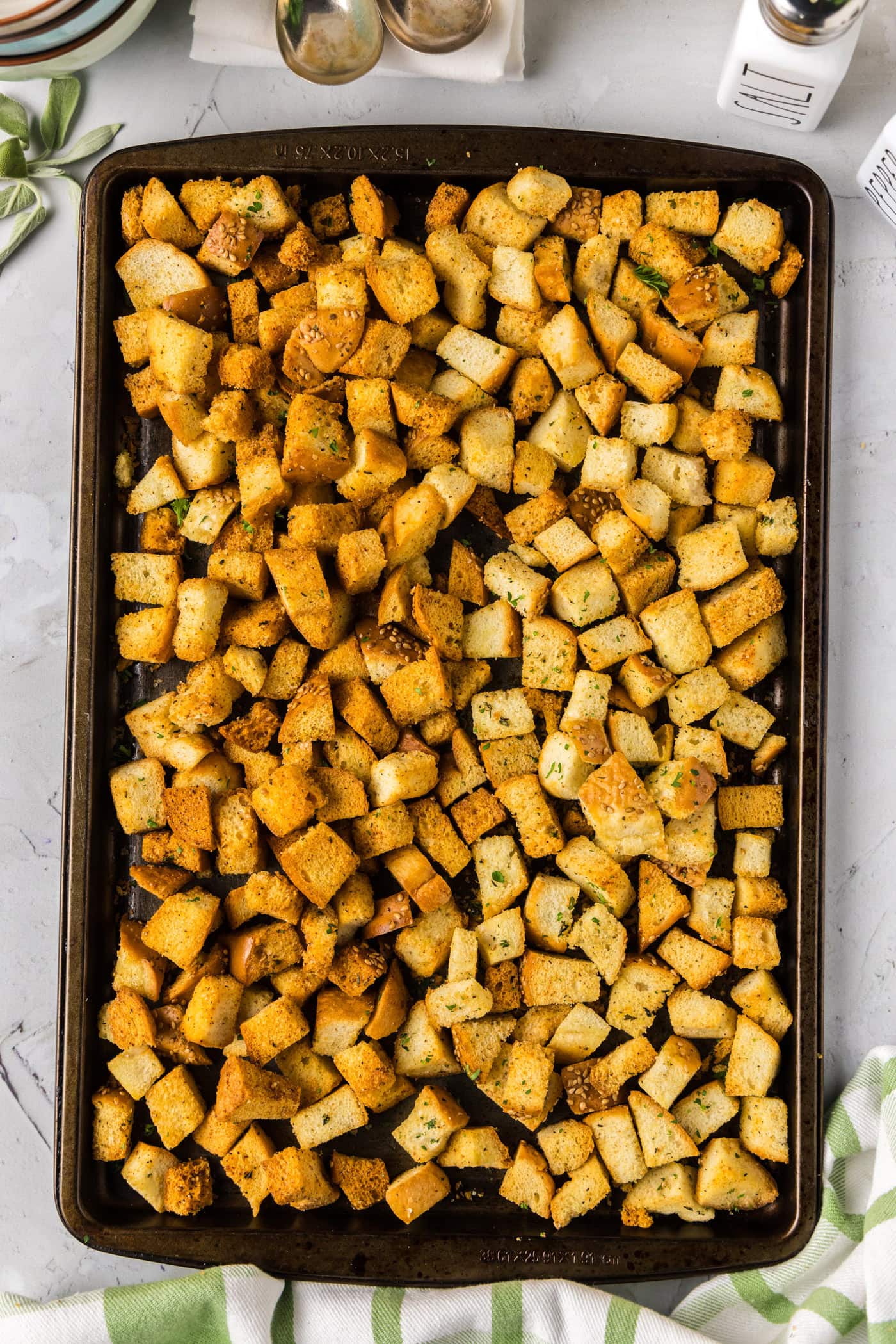 Baking sheet of dark and light Homemade Croutons unmixed