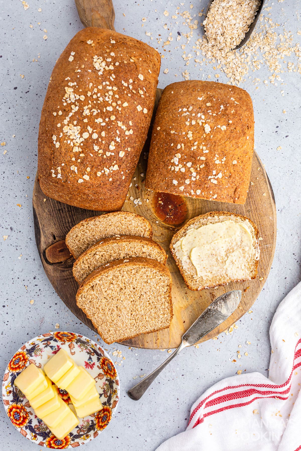 2 loaves of multigrain bread on a wooden board