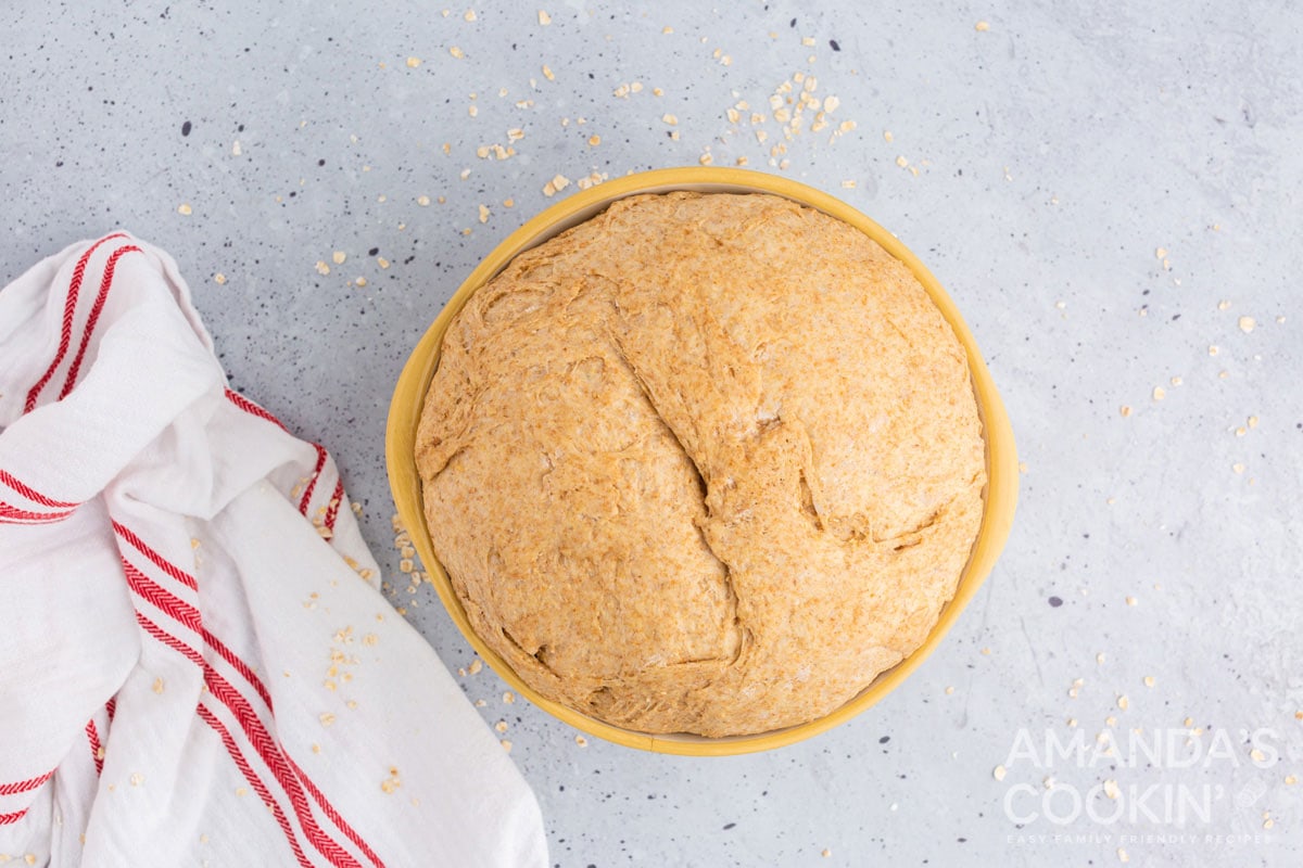 full bowl of bread dough that has risen