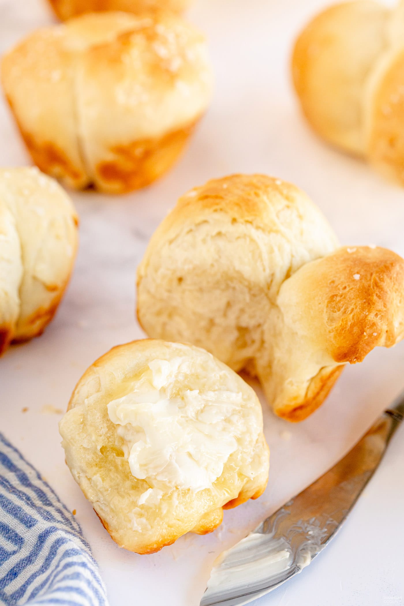 butter on a Homemade Pull Apart Dinner Roll