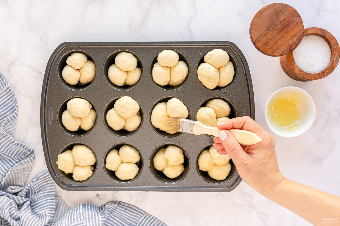 brushing dough with butter