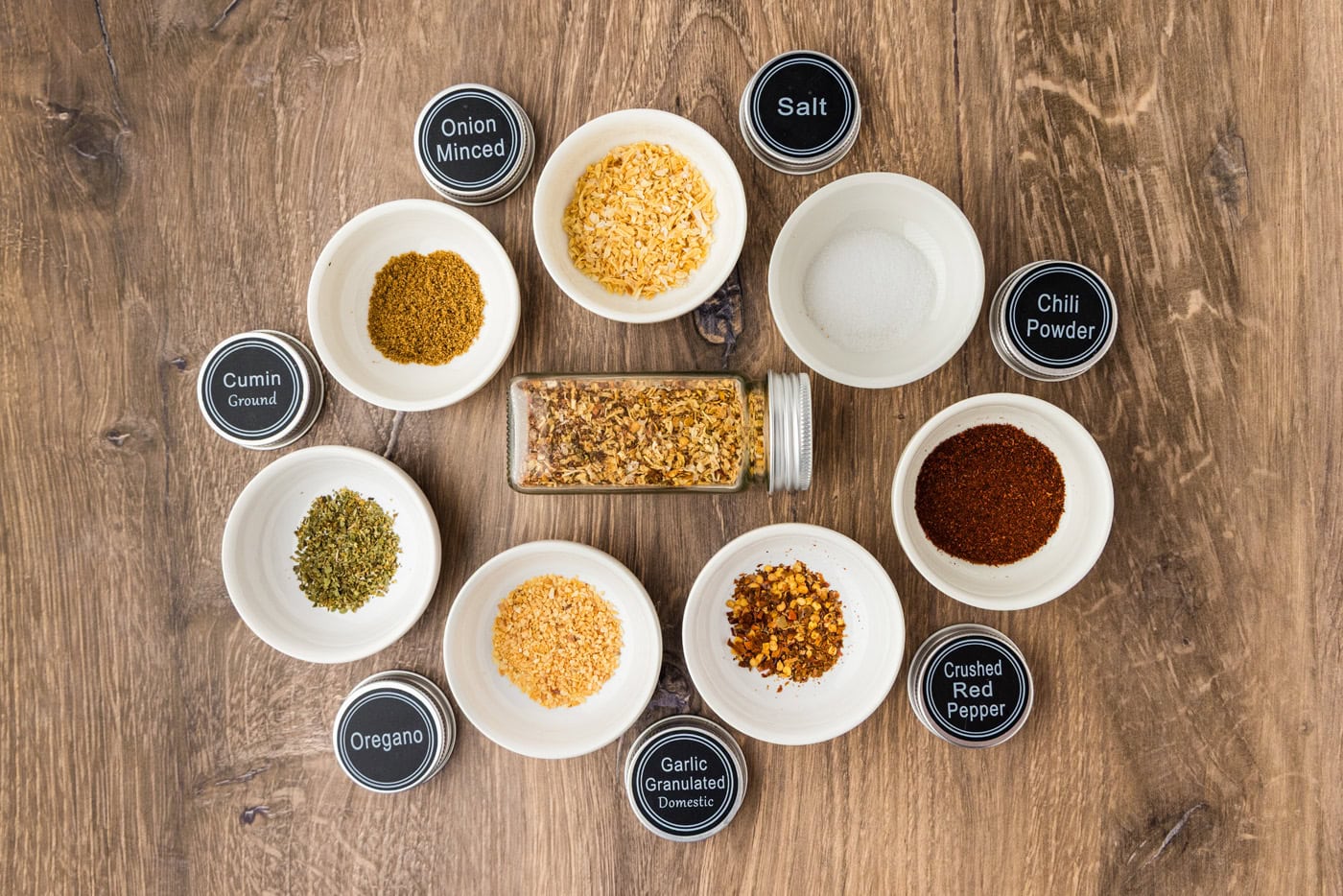 ingredients for taco seasoning mix in small white bowls