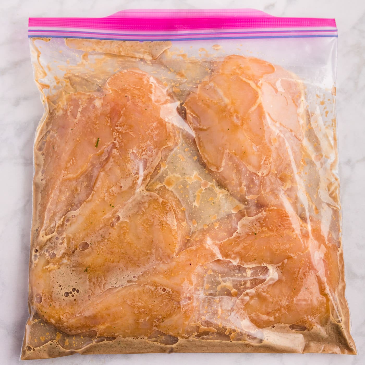 Honey Garlic Chicken Marinade in a bag with chicken breasts