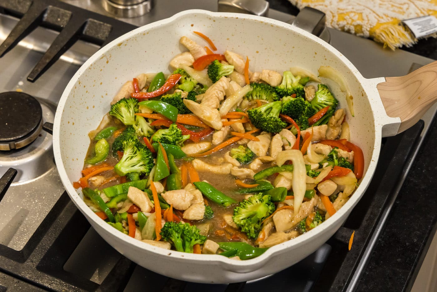 stir fried honey garlic chicken in a skillet