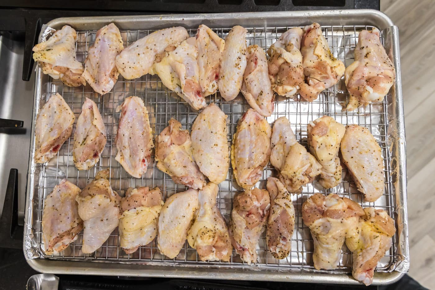 raw chicken wings on a baking sheet