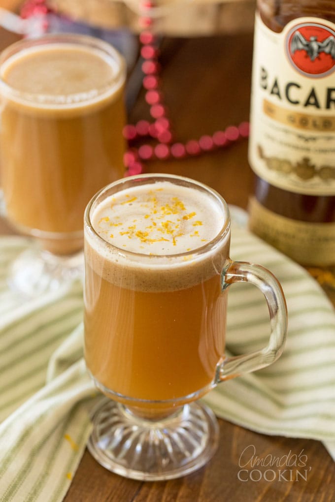 2 glass mugs of buttered rum