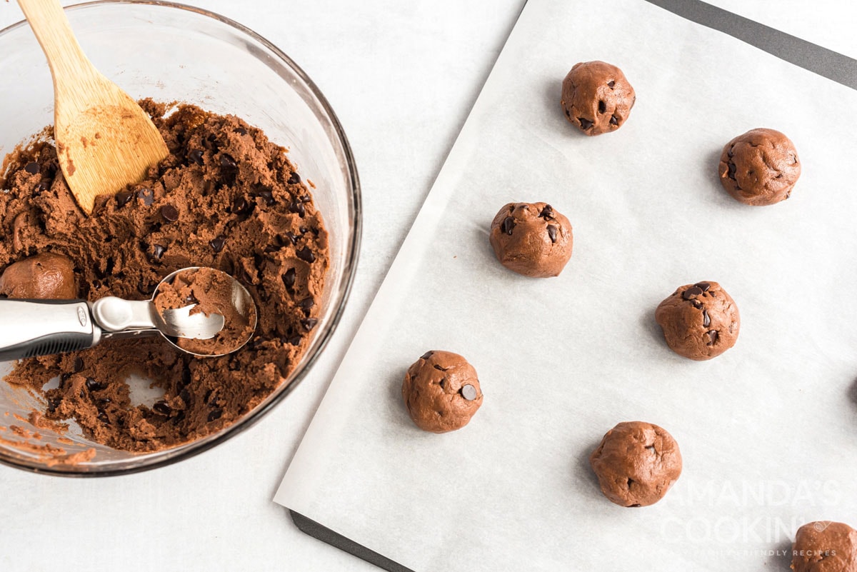 cookie dough balls on baking sheet