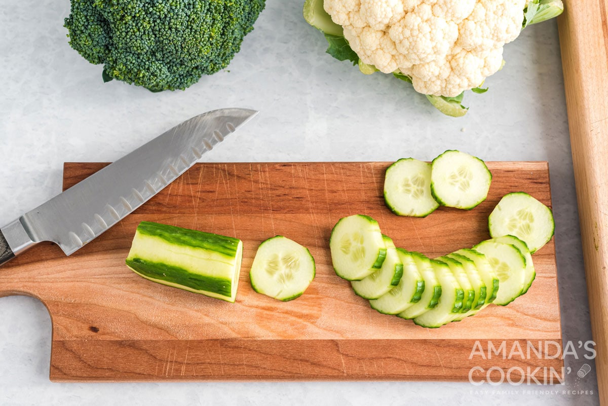 sliced cucumber on a cutting board
