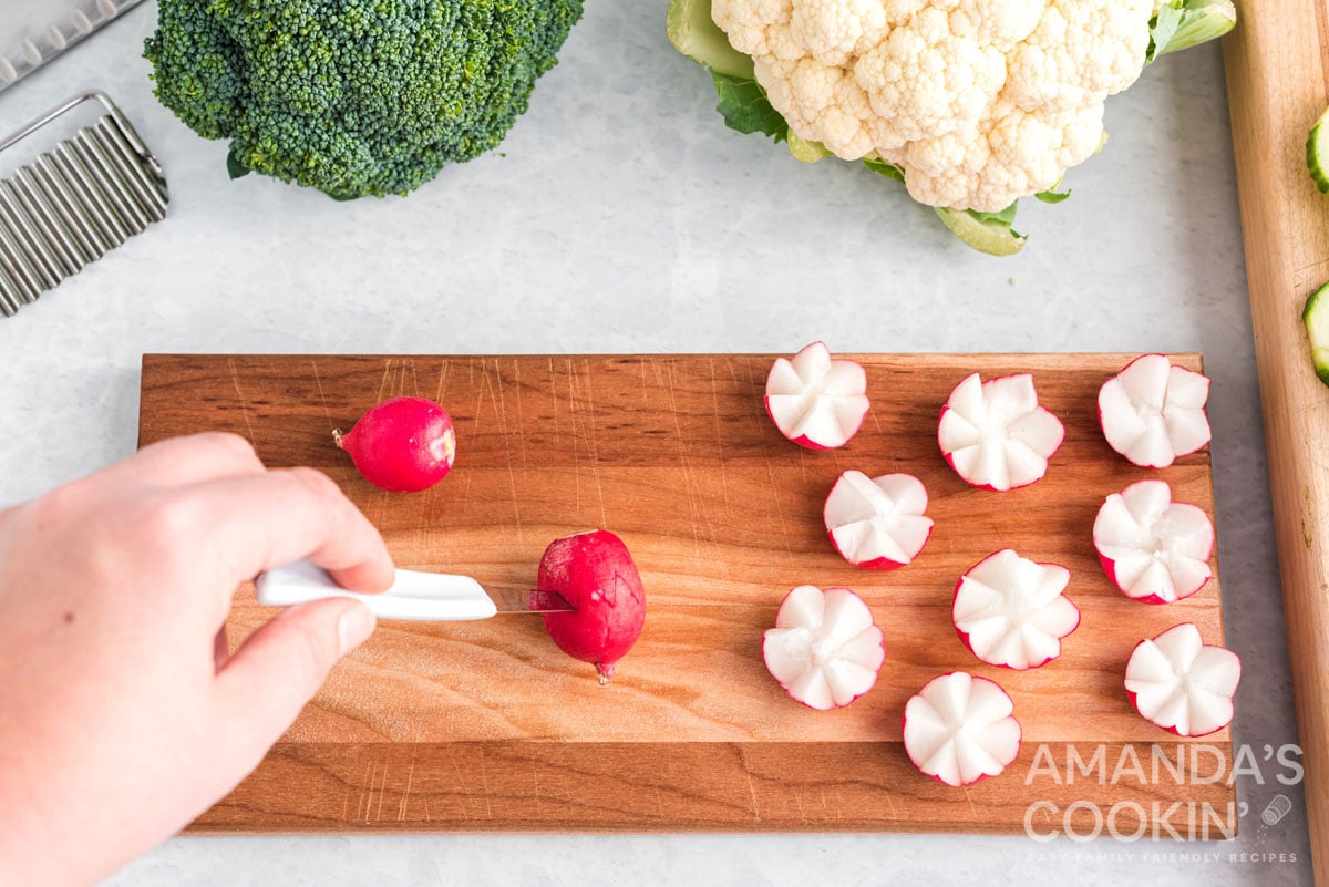 slicing a radish to make a radish flower