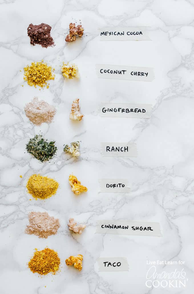 several popcorn seasonings with labels describing them