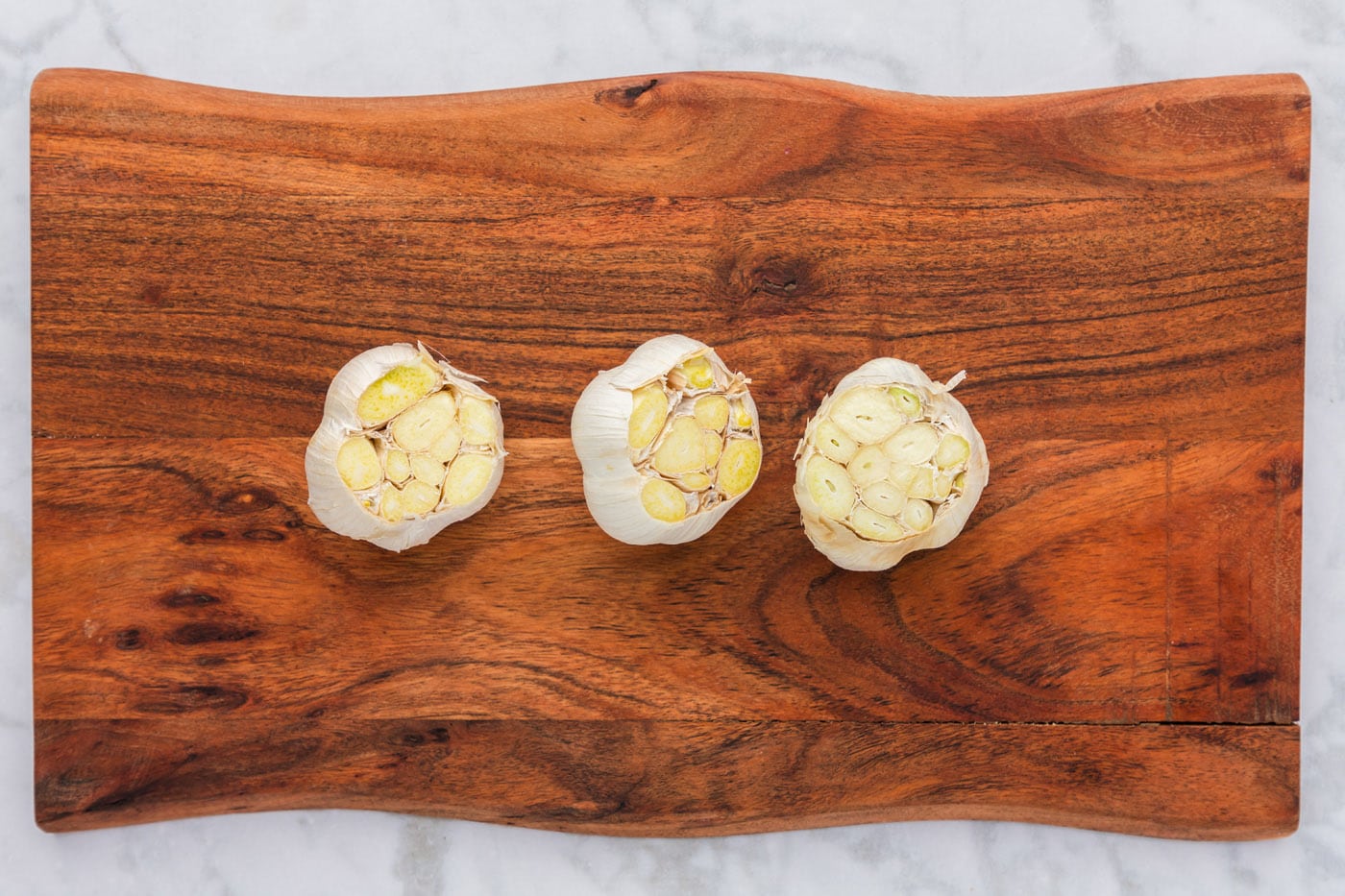garlic bulbs with the tips sliced off
