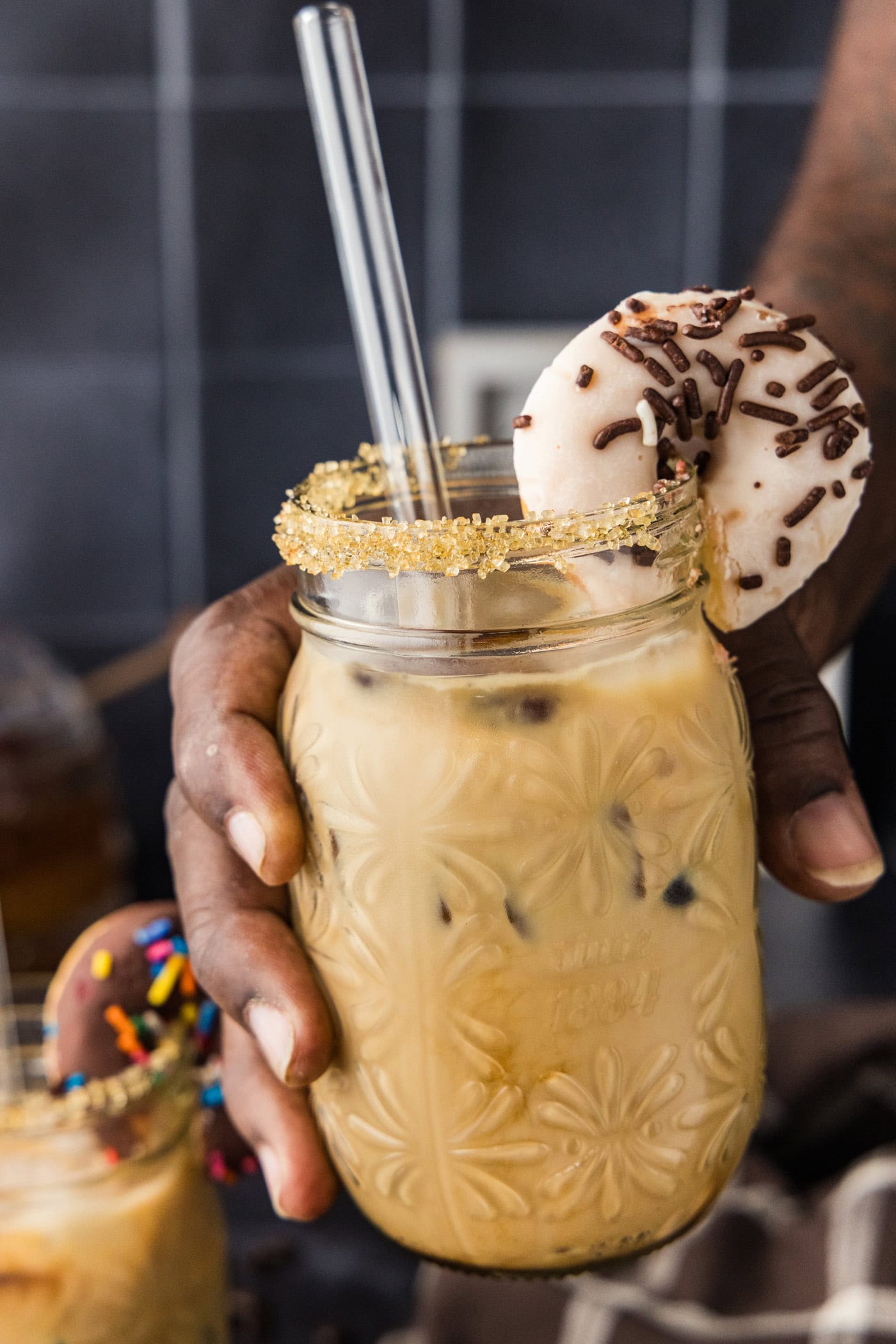 Hand holding up an Iced Espresso Cocktail