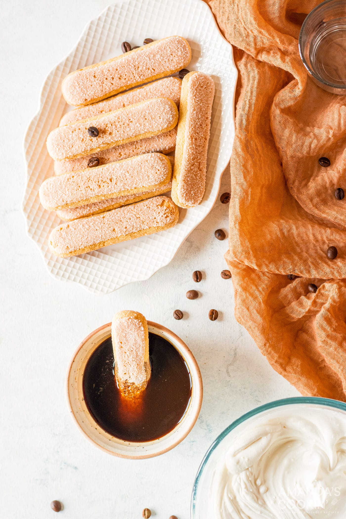 dipping a ladyfinger into coffee