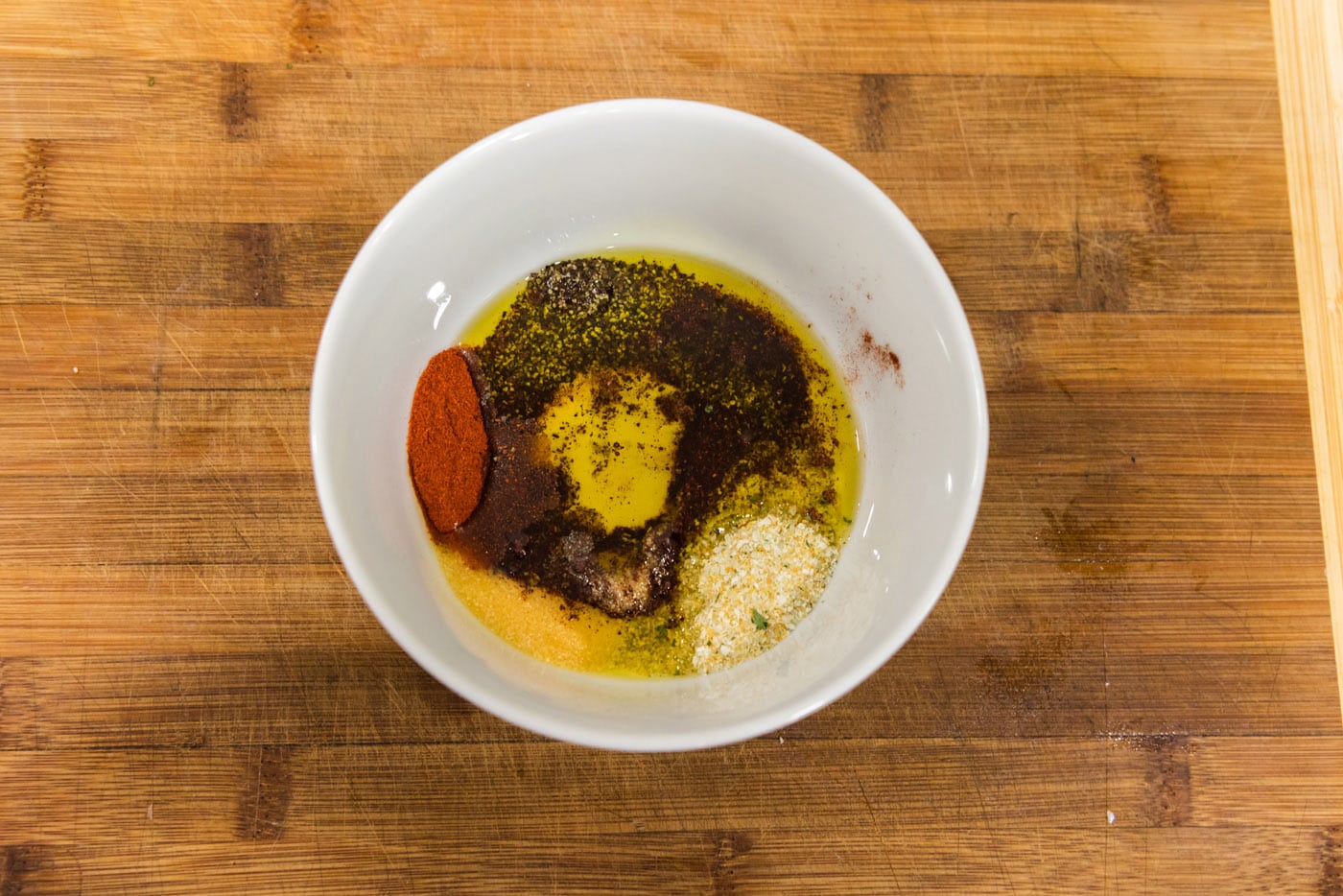 seasonings in a bowl with olive oil