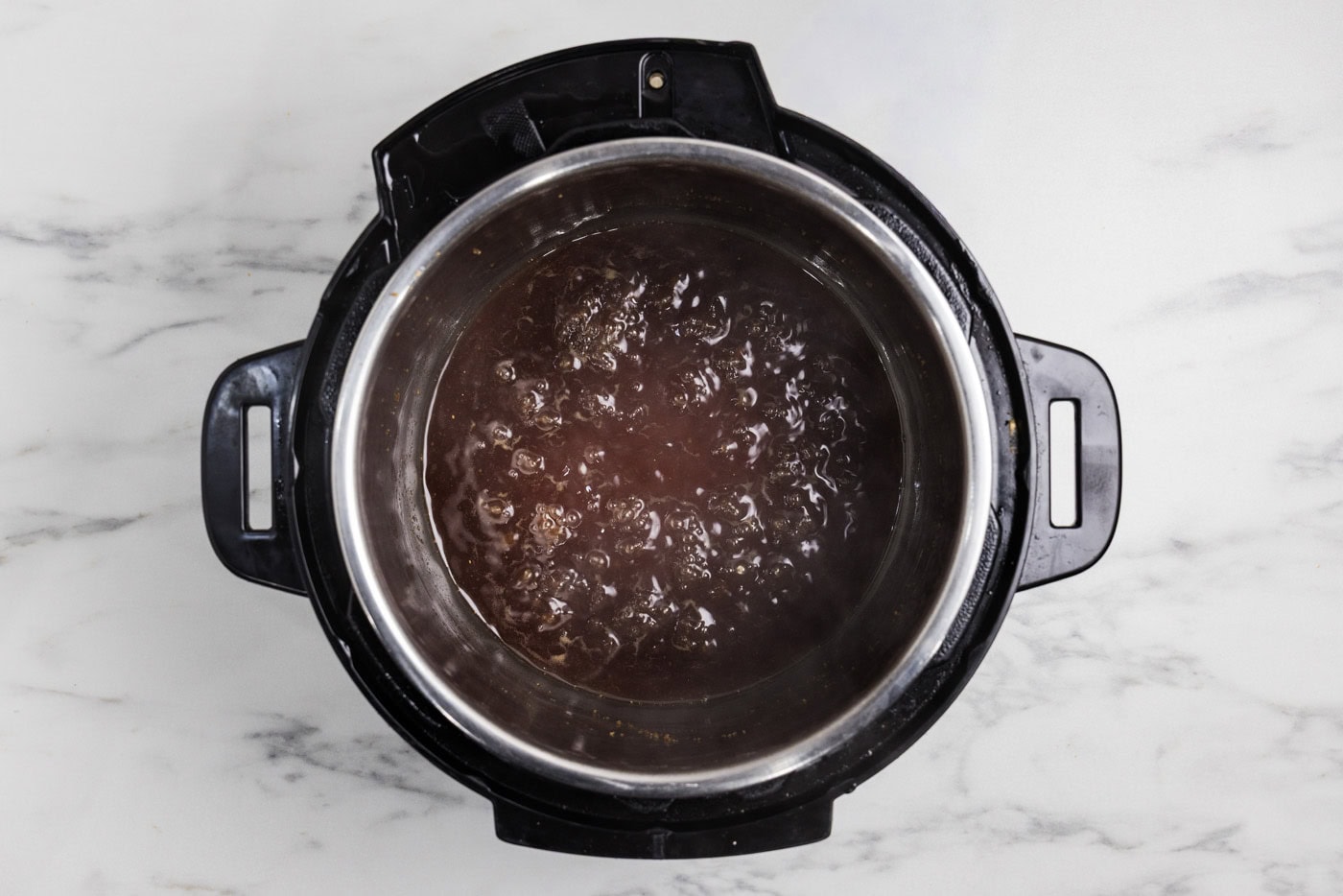 honey garlic sauce boiling in the instant pot